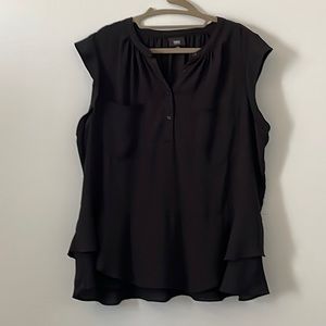 Lightweight sleeveless top with ruffled bottom.